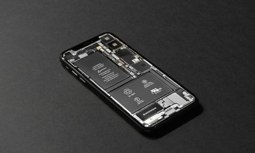 High-resolution image of a smartphone showcasing its internal components on a dark surface.